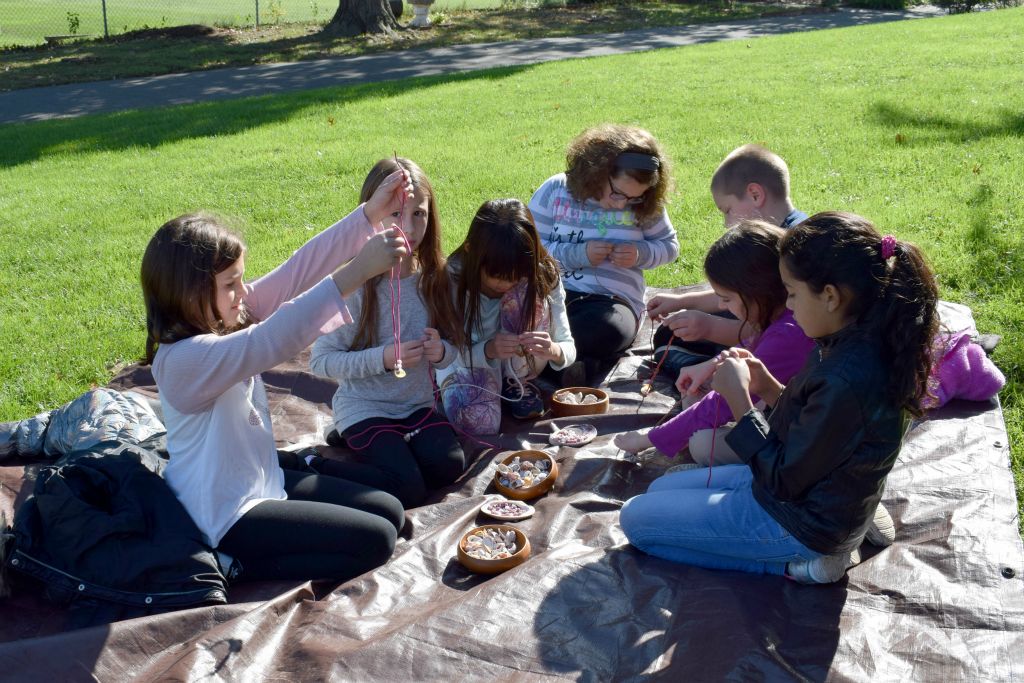 students making necklaces 